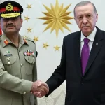 Field Marshal Syed Asim Munir receiving a guard of honour at a military headquarters.