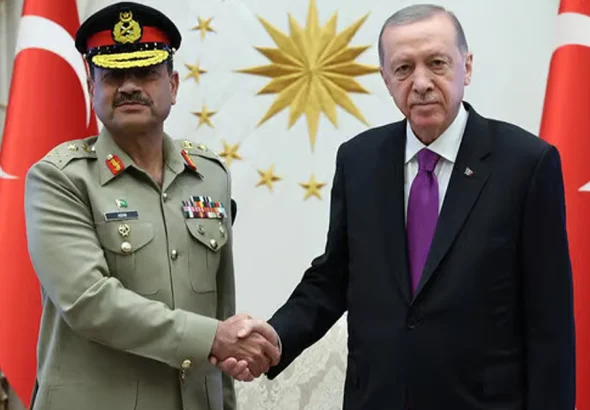 Field Marshal Syed Asim Munir receiving a guard of honour at a military headquarters.