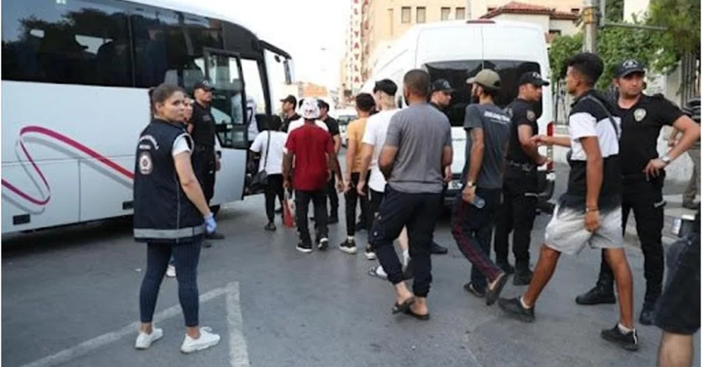 Turkish migration management officials detaining illegal immigrants.
