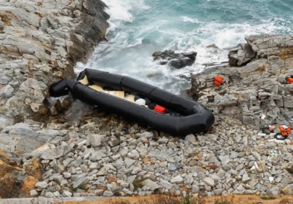 Overcrowded migrant boat at sea near Greek island Lesbos during coast guard rescue operations